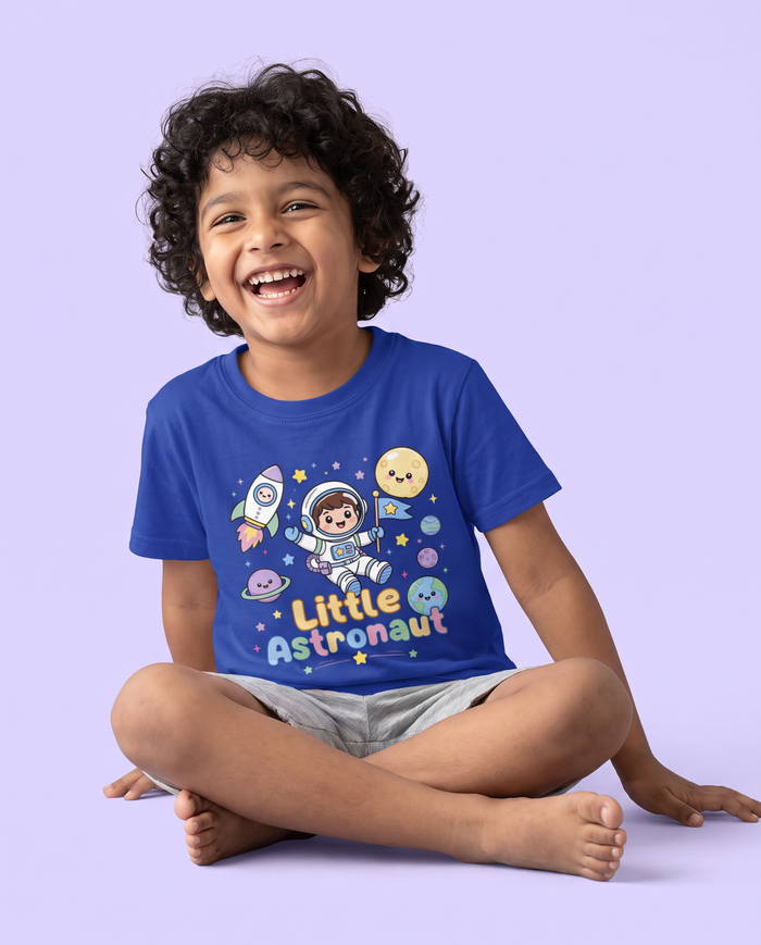 Boy laughing in the Little Astronaut tee