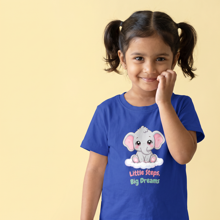 Girl smiling in the Little Steps Big Dreams elephant tee