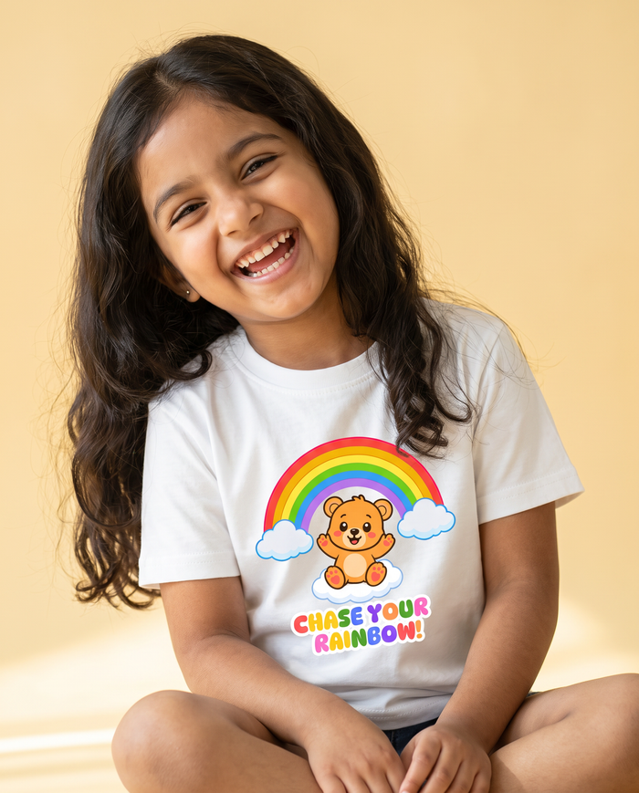 Girl laughing in the Chase Your Rainbow tee